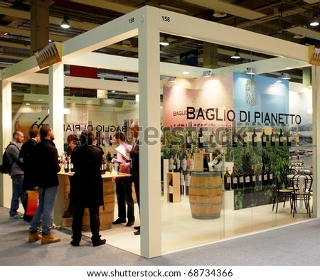 VERONA - APRIL 08: Visiting local wines production stands at Vinitaly, international wine and spirits exhibition April 08, 2010 in Verona, Italy.