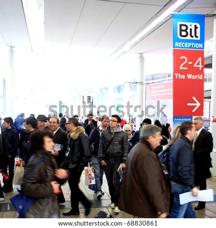 MILAN, ITALY - FEBRUARY 20: People entering tourism areas and stands at BIT, International Tourism Exchange Exhibition February 20, 2010 in Milan, Italy.