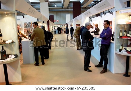 VERONA - APRIL 08: People visit tasting wine areas and wine production stands at Vinitaly, international wine and spirits exhibition April 08, 2010 in Verona, Italy.