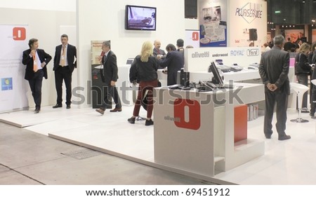 MILAN, ITALY - OCT. 21: People visiting office technology stands at SMAU, national fair of business intelligence and information technology October 21, 2009 in Milan, Italy.