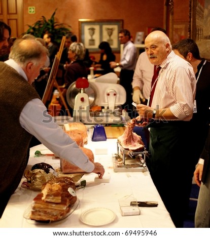 MILAN, ITALY - NOV. 8: Tastaing ham at Golosaria, national fair of food and gastronomy culture November 9, 2009 in Milan, Italy.
