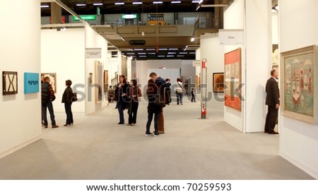 MILAN - MARCH 27: People walk trough work of arts galleries during MiArt ArtNow, international exhibition of modern and contemporary art March 27, 2010 in Milan, Italy.