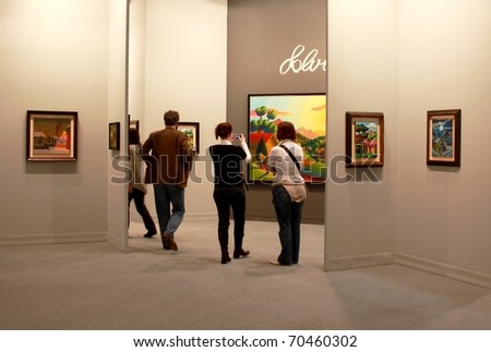 MILAN - MARCH 27: People look at arts galleries during MiArt ArtNow, international exhibition of modern and contemporary art March 27, 2010 in Milan, Italy.