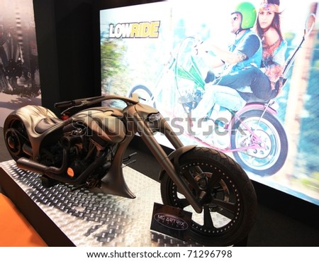 MILAN, ITALY - NOV. 03: Low rider customization motorcycle in exhibition at EICMA, 68th International Motorcycle Exhibition November 03, 2010 in Milan, Italy.