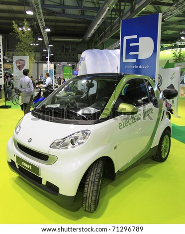 MILAN, ITALY - NOV. 03: Green energy mobility car in exhibition at EICMA, 68th International Motorcycle Exhibition November 03, 2010 in Milan, Italy.