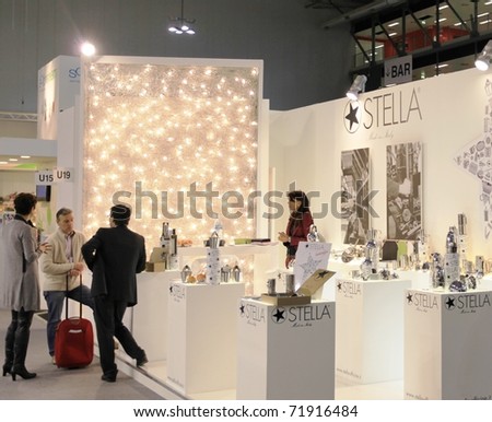 MILAN, ITALY - JANUARY 28: People walk through stands looking for design and interior decoration products at Macef, International Home Show Exhibition January 28, 2011 in Milan, Italy.