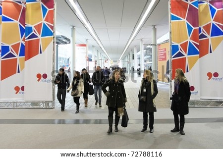 MILAN, ITALY - JANUARY 28: People entering design and interior decoration products expo at Macef, International Home Show Exhibition January 28, 2011 in Milan, Italy.