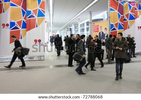 MILAN, ITALY - JANUARY 28: People entering design and interior decoration products expo at Macef, International Home Show Exhibition January 28, 2011 in Milan, Italy.