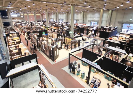 MILAN, ITALY - MARCH 26: Panoramic view of people visiting frames and art stands at Frame Art Expo, Photoshow, International Photo and Digital Imaging Exhibition on March 26, 2011 in Milan, Italy.