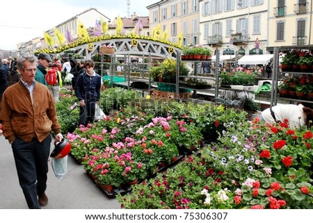 MILAN, ITALY - APRIL 11: People look for flowers and garden products at the annual Flowers Market in the fashion and culture Navigli area April 11, 2010 in Milan, Italy.