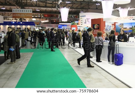 MILAN, ITALY - FEBRUARY 20: People visit World and Italy tourism pavilions during BIT, International Tourism Exchange Exhibition on February 20, 2011 in Milan, Italy.