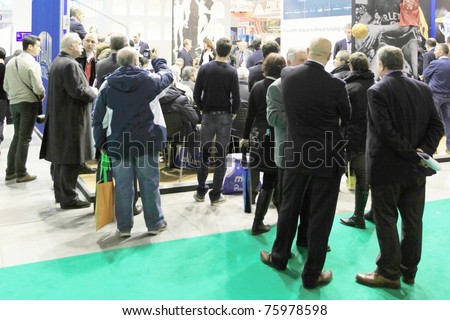 MILAN, ITALY - FEBRUARY 20: People visit World and Italy tourism pavilions during BIT, International Tourism Exchange Exhibition on February 20, 2011 in Milan, Italy.