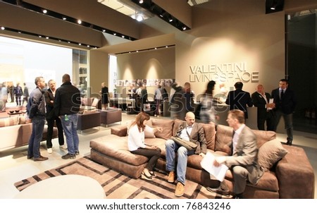 MILAN - APRIL 13: People look at interiors design stands and home architecture solutions visiting Salone del Mobile, international furnishing accessories exhibition on April 13, 2011 in Milan, Italy.