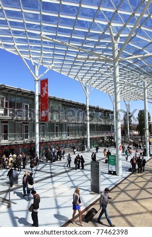 MILAN - APRIL 13: People at the entrance of exhibition, ready to visit design pavilions at Salone del Mobile, international furnishing accessories exhibition on April 13, 2011 in Milan, Italy.