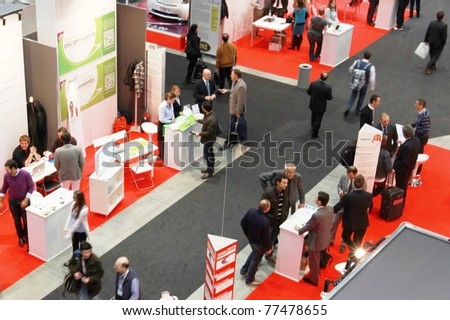 MILAN, ITALY - OCT. 21: People visiting technology stands at SMAU, national fair of business intelligence and information technology October 21, 2009 in Milan, Italy.