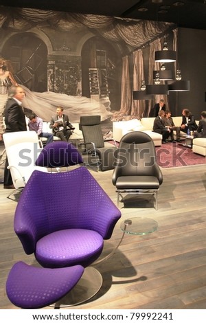 MILAN - APRIL 13: People visit interiors design stands looking for home architecture solutions at Salone del Mobile, international furnishing accessories exhibition on April 13, 2011 in Milan, Italy.