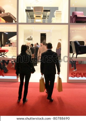 MILAN - APRIL 13: People enter interior design solutions stands at Salone del Mobile, international furnishing accessories exhibition on April 13, 2011 in Milan, Italy.