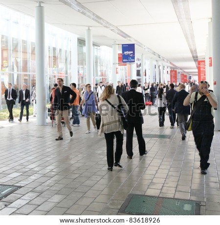 MILAN - APRIL 13: People enter Salone del Mobile, international furnishing accessories exhibition on April 13, 2011 in Milan, Italy.