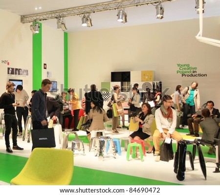 MILAN - APRIL 13: Visitors look at interiors design and home architecture solutions, Salone del Mobile, international furnishing accessories exhibition on April 13, 2011 in Milan, Italy.