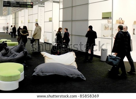 MILAN, ITALY - FEBRUARY 26: People visit fashion products stands during Milano women\'s prêt-à-porter collections February 26, 2010 in Milan, Italy.