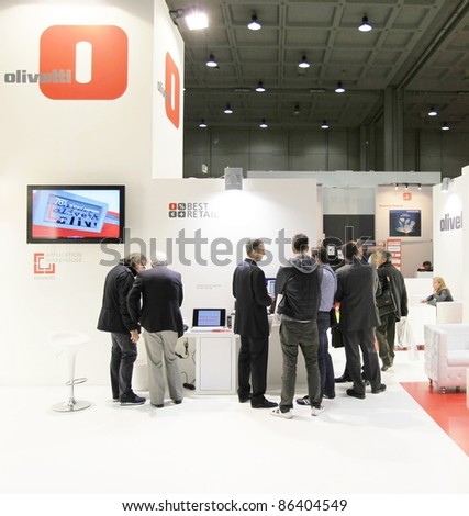 MILAN, ITALY - OCT. 20: People visit Olivetti products stands at SMAU, international fair of business intelligence and information technology October 20, 2010 in Milan, Italy.