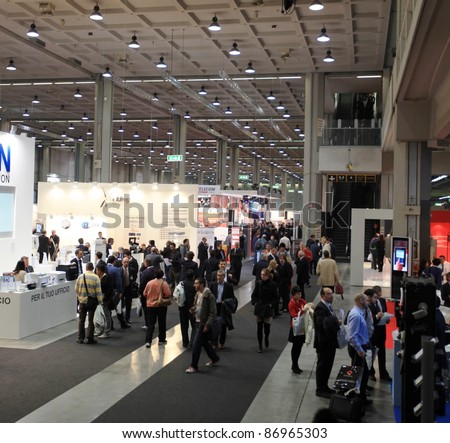 MILAN, ITALY - OCT. 19: People participate to business conference at SMAU, international fair of business intelligence and information technology October 19, 2011 in Milan, Italy.