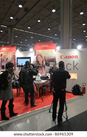 MILAN, ITALY - OCT. 19: Interview at Canon technologies stand at SMAU, international fair of business intelligence and information technology October 19, 2011 in Milan, Italy.