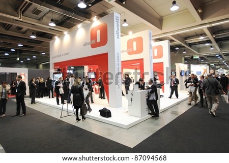 MILAN, ITALY - OCT. 19: People at Olivetti technologies area during SMAU, international fair of business intelligence and information technology October 19, 2011 in Milan, Italy.