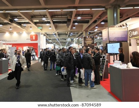 MILAN, ITALY - OCT. 19: Panoramic view of people visiting technologies stands at SMAU, international fair of business intelligence and information technology October 19, 2011 in Milan, Italy.