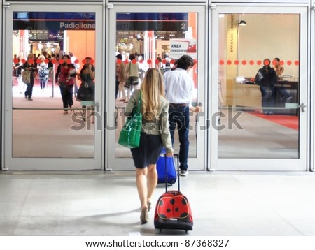 MILAN, ITALY - SEPTEMBER 09: People entering architecture and interiors design pavilions at Macef, International Home Show Exhibition on September 09, 2011 in Milan, Italy.