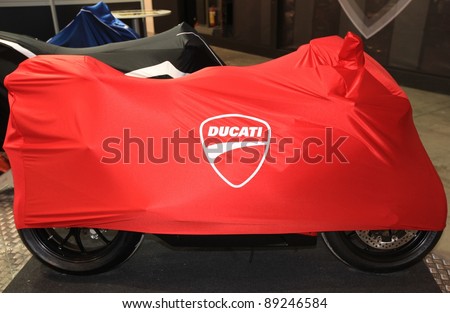 MILAN, ITALY - NOV. 11: Ducati motorcycle cover in exhibition at EICMA, 69th International Motorcycle Exhibition November 11, 2011 in Milan, Italy.
