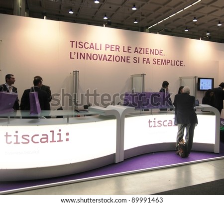 MILAN, ITALY - OCT. 19: People visit Tiscali technologies stands at SMAU, international fair of business intelligence and information technology October 19, 2011 in Milan, Italy.