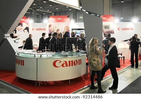 MILAN, ITALY - OCT. 19: People visit Canon technologies stands at SMAU, international fair of business intelligence and information technology October 19, 2011 in Milan, Italy.
