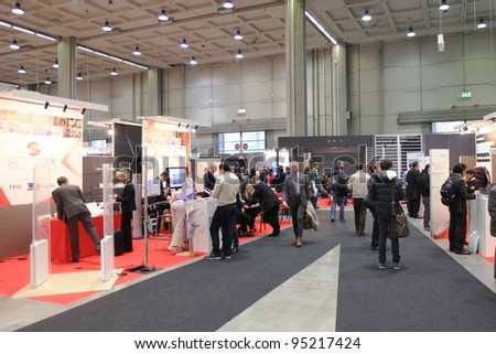 MILAN, ITALY - OCT. 19: People visit technologies stands at SMAU, international fair of business intelligence and information technology on October 19, 2011 in Milan, Italy.