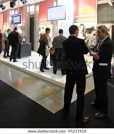 MILAN, ITALY - OCT. 19: People visit Telecom technologies stands at SMAU, international fair of business intelligence and information technology on October 19, 2011 in Milan, Italy.