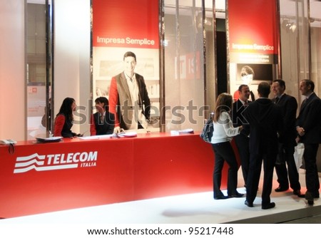 MILAN, ITALY - OCT. 19: People visit Telecom technologies stands at SMAU, international fair of business intelligence and information technology on October 19, 2011 in Milan, Italy.