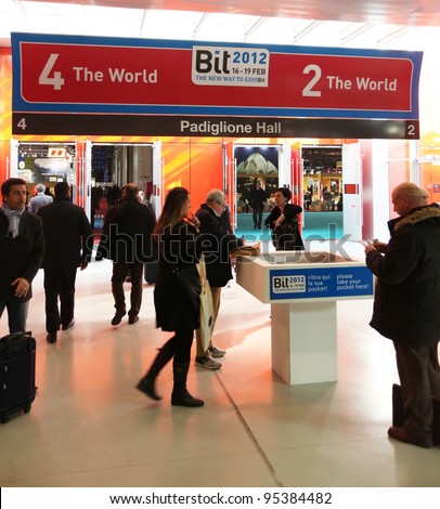 MILAN, ITALY - FEBRUARY 16: People enter World tourism exhibition area during BIT, International Tourism Exchange Exhibition February 16, 2012 in Milan, Italy.