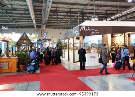 MILAN, ITALY - FEBRUARY 16: People visit Malaysia tourism exhibition area during BIT, International Tourism Exchange Exhibition February 16, 2012 in Milan, Italy.