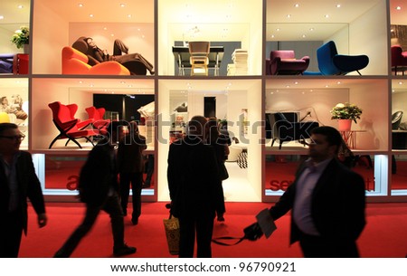 MILAN - APRIL 13: People visit interiors design exhibition area at Salone del Mobile, international furnishing accessories exhibition on April 13, 2011 in Milan, Italy.