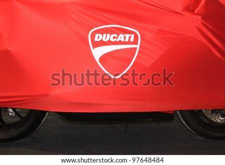 MILAN, ITALY - NOV. 11: Ducati motorcycle cover in exhibition at EICMA, 69th International Motorcycle Exhibition on November 11, 2011 in Milan, Italy.