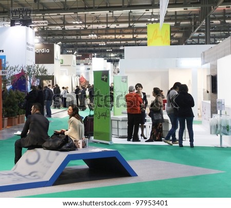 MILAN, ITALY - FEBRUARY 16: People visit tourism stand at Italy exhibition area during BIT, International Tourism Exchange Exhibition on February 16, 2012 in Milan, Italy.