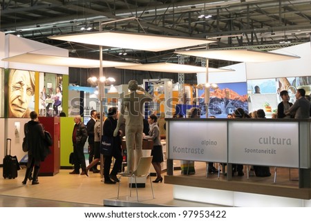 MILAN, ITALY - FEBRUARY 16: People visit tourism stands at Italy exhibition area during BIT, International Tourism Exchange Exhibition on February 16, 2012 in Milan, Italy.