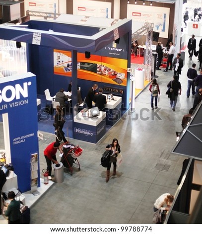 MILAN, ITALY - OCT. 21: People visiting technology stands at SMAU, national fair of business intelligence and information technology October 21, 2009 in Milan, Italy.