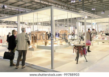 MILAN, ITALY - JANUARY 28: People visit design and interior decoration products stands at Macef, International Home Show Exhibition on January 28, 2011 in Milan, Italy.