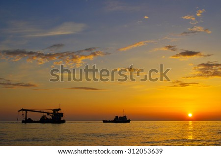 the sun sets in the sea. stunning views. On the horizon ships.