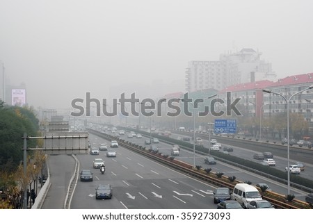 BEIJING, CHINA - NOVEMBER 14, 2015: Zhongguancun street in beijing during air pollution. Air pollution is a serious problem in Beijing.