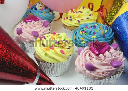 party scene with colourful cakes and balloons