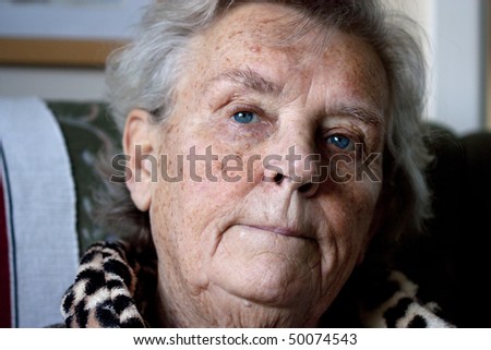 worried elderly lady with a pensive or thinking facial expression