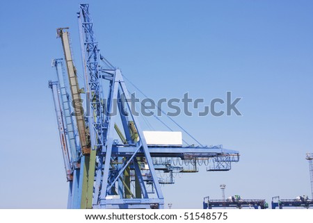 big blue cranes at the dcosk for laoding container ships