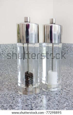 salt and pepper shakers on a granite worktop